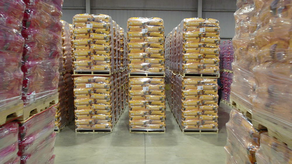How to Prevent Pallet Overhang in Animal Feed Operations
