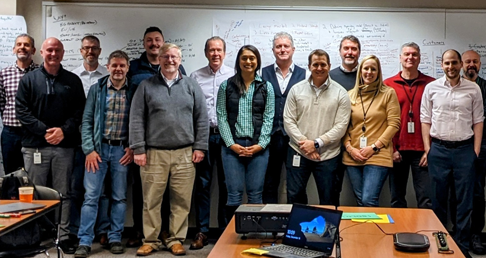 BW Packaging leaders in front of a white board